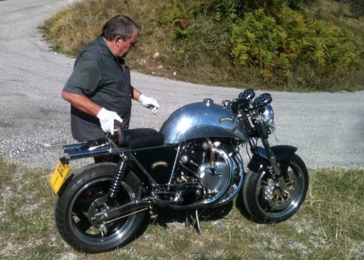 Colin preparing a bike for her first road laps after restoration. Note that the pipes are under the seat.