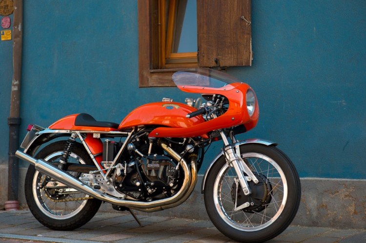 Godet 1330 Cafe Racer in a stunning racing orange. There is a story beside this picture says Pierre. “We were riding along on our Nortons in the French Vosges Mountains, and we saw a bunch of Vincent Motorcycles coming at us on the other side of the road. We stopped them and recognized our friend Serge Raspoutine Vollard with Fritz Egli and Patrick Godet on a rally with the club. They were lost and we shown them the right way, then we went together for a beer in a local pub, that’s where Vincent took this picture.”  Photographer Vincent Michel | RAD Motorcycles