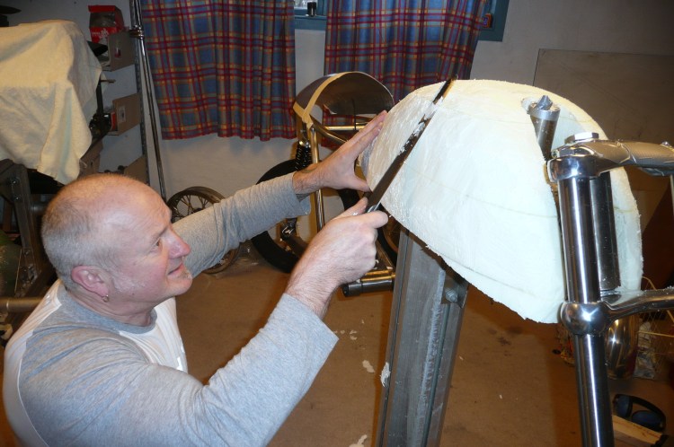 Dag starts the process to manufacture the tank by carving rough styrofoam.