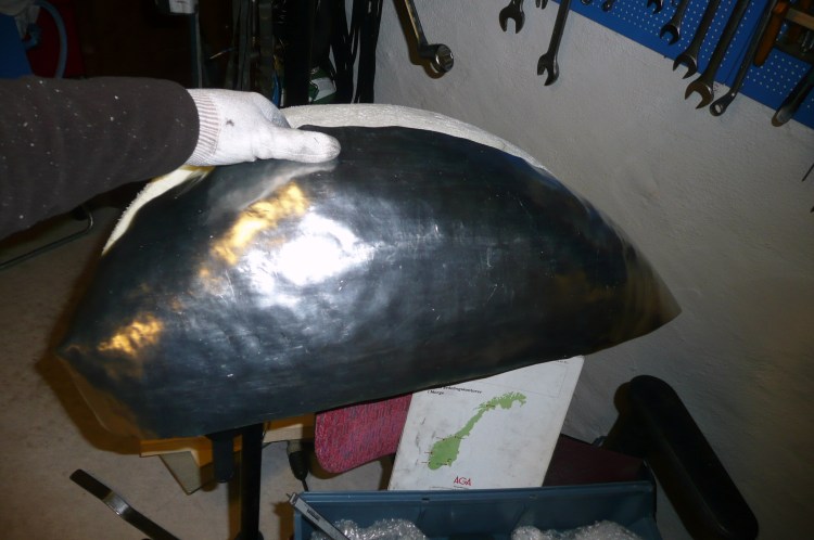 Aluminum sheets are cut with shears and formed on the bench.