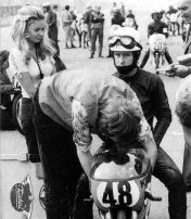 22.For Jarno Saarinen, I had to select a picture with his wife, which was supporting him in every race. There is a famous shot where Soeli is simply dressed with a bikini holding high the stopwatch board in the pit lane. I leave you make some research on Google  Active racing:1970 - 1973 Team: Yamaha Won 1 Championship  250cc | 1972