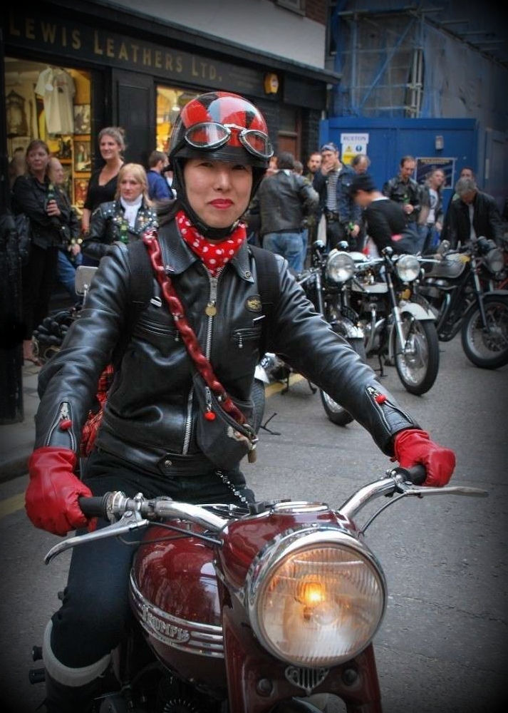 Definitely very feminine, a few touches of red, included the lipstick almost coordinated with her Triumph SpeedTwin and this unknown rider became "The Lady in Red".