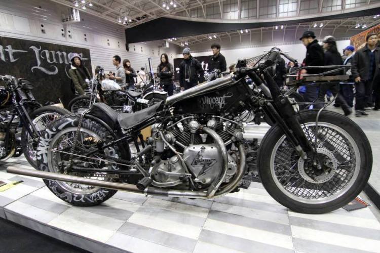 At the intersection of several schools, I would vote rather for the first one because the essential attributes of a RAT are in it:  1. "I don't give a sh-- to the aesthetic of my bike" 2. "I prefer to spend more time on the road than in my garage".  Anyway, this radical but reversible transformation triggers controversy but also respect for those who have a different opinion. This bike resides in Japan and is ridden daily by his owner John Krena.