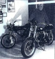 Tony in front of the project and in the background the donor bike. Note the mock-up frame specially built to connect the UFM (upper frame) to the RFM (rear frame), a quite clever approach that will prevent the loss of these parts for the future. Photo courtesy Tony Blackstock