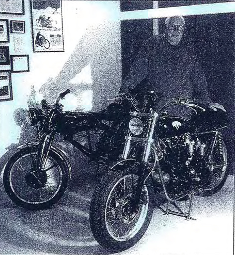 Tony in front of the project and in the background the donor bike. Note the mock-up frame specially built to connect the UFM (upper frame) to the RFM (rear frame), a quite clever approach that will prevent the loss of these parts for the future. Photo courtesy Tony Blackstock
