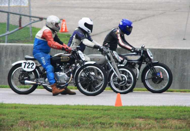 From left to right, Tom Kerr on a Comet B, David Dunfey  on the Comet C and Alex McLane on the Stu Rogers Norton on the starting line at Virginia International Raceway.