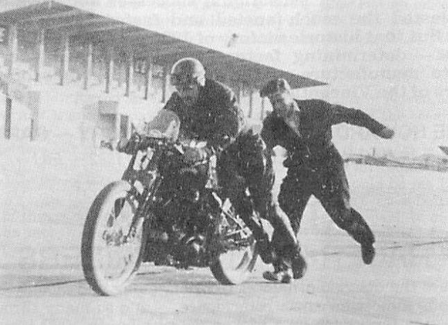 Ted Davies on the Lightning, gets a push off from Jacl Lazenby, during the Montlhery record attempt. This picture supplied by Ted Davies himself shows that the record bike is indeed different from the official pictures.