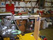 The tubes saddle are being welded, Glen mentions it's not easy finding a good position for all the tight angles, the welding helmet sometimes prevents a close view