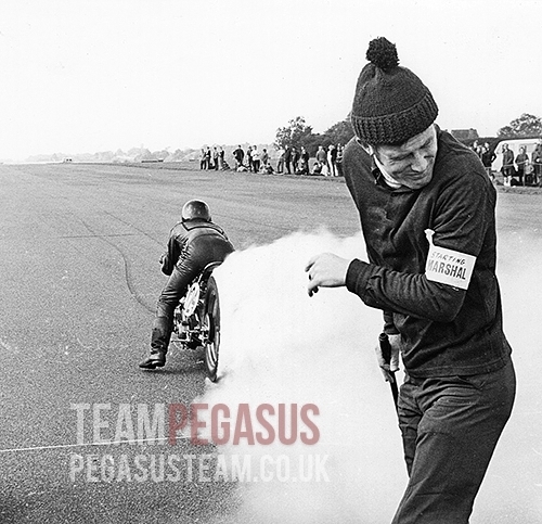 “A great shot from an unknown photographer taken at an NSA sprint event with Ian proving the job of a startline marshal can be a hazardous one. In the "Blog" pages you will find a short cine clip of this run. 1969, RAF Debden, Essex UK”. Picture and information © TeamPegasus