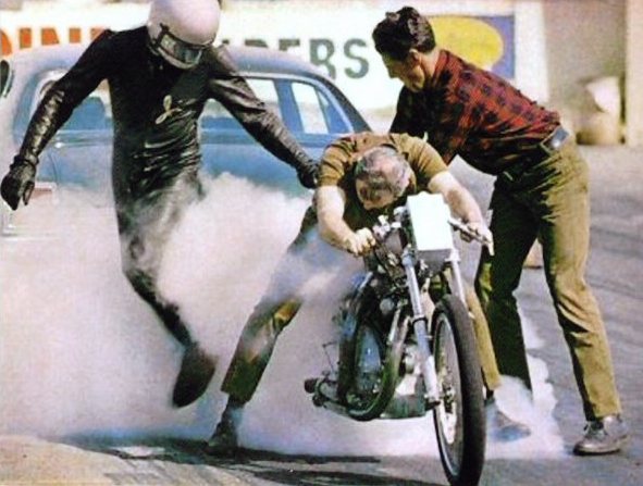 This photo taken in the early 1970’s shows Clem Johnson doing the burn out, between Jim Leineweber (L) and Ralph Owen (R) This photo was once used on bubble-gum trading cards.  Photo courtesy of Jim Leineweber photo archive.