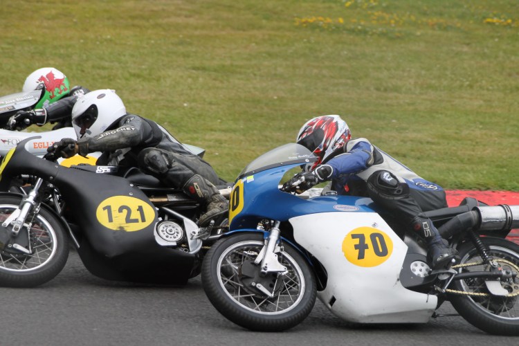 Elbow to elbow, Alex inside the corner with HHHH (#121) and GGGG (#70)