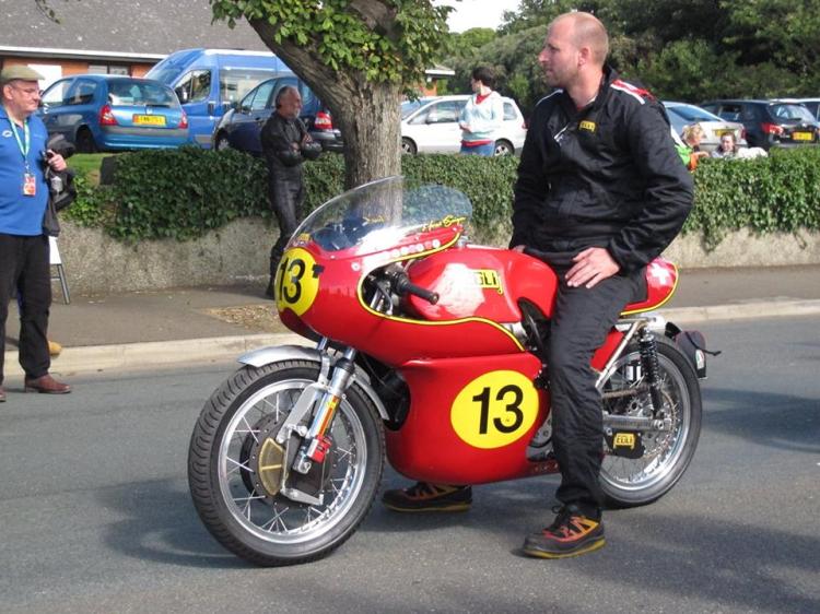 Egli Racing mechanic astride Horst Saiger's Grey Flash.